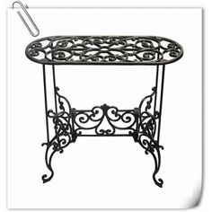 a wrought iron table with a paper clip