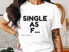 Celebrate your single and carefree lifestyle with our "Single as F..." T-Shirt. This bold and playful t-shirt is perfect for those who embrace their independence and enjoy the single life. Wear it proudly and let the world know that you're happily rocking the single status. Express yourself and have fun with this statement t-shirt designed for single and happy individuals. Carefree Lifestyle, Happy Single, Single Status, Statement Tshirt, Single And Happy, Single Life, Funny Tshirt, Simple Shirts, Shirt Price