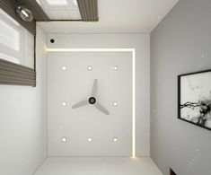 a white room with a clock on the wall