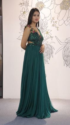 A mix of royal and modern, this long dress in Sea Green colour handcrafted on georgette with multicolour crystal and stripes has an entirely different look because of the jacket. Style this for the classic indo western look.Fabric- georgette with net, work- metal stripes with multicolor crystalOccasion: Wedding ,Cocktail, Family & Pooja,Reception ,EngagementNo. Of Components: 1 Style: Gown Fabric: Georgette Work: Sequin, Cut dana Colour: Sea Green Chest: 36 Note:- Originally Stitched in 36 but c Floor-length Georgette Gown For Gala, Festive Georgette Gown For Gala, Festive Floor-length Hand Embellished Evening Dress, Hand Embellished Maxi Evening Dress For Festive Occasions, Hand Embellished Maxi Length Festive Evening Dress, Festive Hand Embellished Floor-length Evening Dress, Sequin Floor-length Lehenga For Gala, Floor-length Sequined Lehenga For Gala, Hand Embellished Maxi Gown For Gala