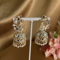 Very light gold mixed metal earring with mirror detail on peacock design.  1.5 inch x 0.5 inch  Light weight and perfect for festivals NOTE mirrors may have slight imperfections as item is hand made  Ready to ship! Festive Peacock Design Earrings, Gold Bollywood Jhumkas With Peacock Design, Festive Earrings With Peacock Design, Festive Peacock Chandbali Earrings, Festive Chandbali Earrings With Peacock Design, Festive Peacock Design Chandbali Earrings, Gold Bridal Earrings With Peacock Design For Festive Occasions, Festive Gold Bridal Earrings With Peacock Design, Gold Jhumkas With Peacock Design For Celebrations