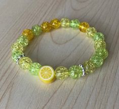 Summer and brightly colored beaded stretch bracelet featuring glass beads and an adorable lemon charm bead.  Available in sizes for kids and adults. 📧  Email Signup Link 📧 Signup for our email list at the link below for updates and special offers https://tinyurl.com/2mh6c8t 🚨⚠️ Reminder ⚠️🚨 Handmade jewelry will not be exactly the same as the picture, some beads may be different than pictured but the color and style will remain consistent. Choking Hazard Warning: This product contains small Yellow Stretch Bracelet With Faceted Beads For Gift, Yellow Stretch Bracelet With Colorful Beads As Gift, Playful Yellow Beaded Stretch Bracelet, Playful Yellow Stretch Bracelet With Colorful Beads, Cute Yellow Stretch Bracelet, Perfect As Gift, Cute Green Stretch Bracelet With Round Beads, Cute Yellow Stretch Bracelet, Gift, Cute Green Round Beads Stretch Bracelet, Cute Yellow Stretch Bracelet As A Gift