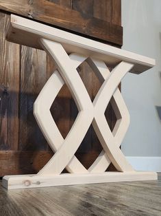 a wooden bench with an x design on it