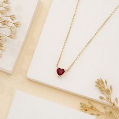 Corin Ruby is a stone of royalty, highly coveted for its rich red hue. This ruby was meticulously cut into the most subtle of hearts so you can wear it every day. It layers well with other dainty necklaces, and alone it almost looks like it is floating on your neck. This is the perfect gift for a girlfriend, daughter, granddaughter or even bridesmaid. - Handmade- Solid Gold- Natural Ruby- Pendant Size: 5 mm- Total Ruby Carat Weight: 0.40 ctw All Sarah Elise ruby jewelry come beautifully boxed in Ruby Heart Necklace, Gold Ruby Necklace, Ruby Heart, Ruby Birthstone, Ruby Pendant, Ruby Necklace, July Birthstone, Ruby Jewelry, Natural Ruby