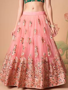 Become the subject of everyone’s conversation by outfitting in this delightful peach color lehenga made with net material designed with mirror work, thread embroidery, and sequin work. This peach lehenga comes with a green color art silk material choli made with embroidery and mirror work. It also comes with a peach color net material dupatta made with thread embroidery and sequin work. This peach lehenga is stitched and can be customized up to 42 inches. The choli will be fully stitched materia Festive Anarkali Embellished Skirt, Semi-stitched Skirt With Resham Embroidery For Reception, Reception Skirt With Resham Embroidery, Semi-stitched, Traditional Skirt With Mirror Work For Reception, Anarkali Skirt With Resham Embroidery For Navratri, Anarkali Skirt With Mirror Work For Reception, Anarkali Embroidered Wedding Skirt, Semi-stitched Skirt For Reception Navratri, Semi-stitched Skirt For Navratri Reception