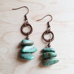 The earring are handcrafted with Natural Turquoise and copper. Perfect to compliment your Boho inspired look!  Material: Natural turquoise, copper Size: Approximately 2" length  Item will resemble the photo. Each piece is created by hand so no two are identical.