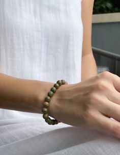 Unakite is a beautiful, grounding stone that helps you connect with the earth. It's said to be especially helpful for those who are constantly on the go, as it provides stability and balance. What could be more perfect than a piece of Unakite Bracelet to keep you connected to the energy of the earth?

This unakite bracelet is the perfect way to bring some positive energy into your life. The unique mix of green and pink crystals is said to promote balance and harmony while helping to enhance your Spiritual Jade Beaded Bracelets For Everyday, Everyday Spiritual Jade Beaded Bracelets, Earthy Natural Stones Bracelet For Healing, Spiritual Jade Bracelets For Everyday, Earthy Green Bracelets For Meditation, Everyday Spiritual Jade Bracelets, Earthy Green Beaded Bracelets For Everyday, Earthy Natural Stones Stretch Bracelet For Healing, Everyday Spiritual Aventurine Bracelets