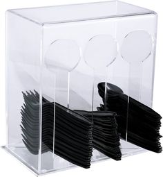 a stack of black and white plates in a clear box