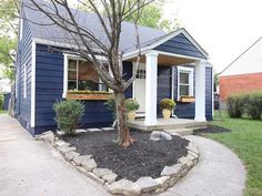 a house with blue siding and white trim