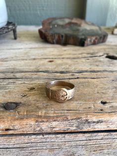 Lovely 9K gold ring. It features a a buckle design. Mark: G.P.S. (maker's mark) .375 (9K gold) Date letter P - (either 1914 04 1939) Anchor (pictorial) Birmingham My sterling and silver items are all with the original patina as when I acquired them. I leave the polishing up to the buyer. *Please visit my shop to find other great vintage items. https://www.etsy.com/shop/SionainnRiverVintage A picture is worth 1000 words. I work very hard to provide you with accurate, detailed pictures of the item Gold Ring Band, Marissa Meyer, Silver Items, Buckle Ring, Birmingham England, Letter P, Gold Band Ring, Detailed Pictures, Maker's Mark