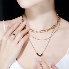 A fascinating place where both vintage and contemporary chain designs meet, Three Chain Amalgam 14K Gold Plated Necklace showcases three graceful chains combined to add an extra layer of elegance and grace to your outer look. A linked chain, close-linked chain, and a close-linked chain with five shimmering geometric pieces are combined to form this majestic art piece. With 14K Gold Plating, that enhances the finesse, wear this necklace as a statement piece on special occasions. Materials & Finis Stainless Steel Chain For Jewelry Making, Yellow Gold Chain Jewelry In Stainless Steel, Yellow Gold Stainless Steel Chain Jewelry, Stainless Steel Snake Chain Jewelry, Stainless Steel Necklace With Rectangular Links For Gifts, Metal Snake Chain Jewelry For Collarbone, Minimalist Jewelry With Rectangular Link Clavicle Chain, Minimalist Double Chain Pendant Jewelry, Minimalist Clavicle Chain Jewelry With Rectangular Links