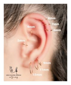 the ear is shown with three different types of piercings on each side of it