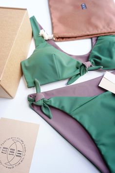 Reversible bikini set, XS size in green +taupe color, 6 in 1 design- color combinations to wear it. "Celine" top with soft cups and comfy ajustable bikini. Eco Sun Day all swimwear made from sustainable fabric which is made from recycled ocean plastic and fishing nets. Composition- 78% Recycled PA + 22% EA. Ethycally made in Lithuania Ready to ship, sending same day! In case You would like to oder this set in other size or color , chek this made to oder item: https://www.etsy.com/listing/1294174 Green Bra-friendly Tie-side Swimwear, Green Tie-side Bottom Swimwear, Bra Friendly, Celine Top, Sun Day, Fishing Nets, Sustainable Fabric, Sustainable Swimwear, Reversible Bikinis, Soft Cup