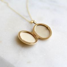 A stunning 9ct solid gold oval locket on a solid gold chain. This is a really special piece and an ideal gift for those who prefer to wear only solid gold. Its great advantage is that it will not fade or tarnish and will remain as beautiful as ever. The necklace comes boxed and on a solid gold link chain. Locket measur