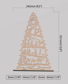 a wooden christmas tree cutout with measurements