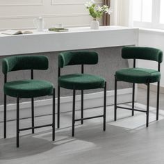 These 24-inch counter height modern, curved-back kitchen island chairs are designed for comfort and style. Featuring a luxurious bouclé fabric, these bar stools with a backrest provide a cozy seating experience. Their sleek, curved back design adds a touch of elegance to your space. Ideal for kitchen counters, these stools prioritize both comfort and aesthetics, making them the perfect addition to home. Ebern Designs Upholstery: Green, Number of Stools: 3 | Ebern Designs Najira 24" Counter Stool Kitchen Island Chairs, Green Bar Stools, Counter Stools With Backs, Mid Century Modern Bar, Island Chairs, White Bar Stools, Cozy Seating, Kitchen Counters, Green Home Decor