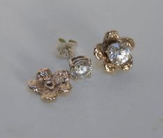 "Flower Ear Jackets / Earring Jackets in a Flower design, 5 petal flower best for Medium studs 3mm to 5mm (1/2ct) stones. Hole is big enough for screw backs or regular posts. Many of your small earrings studs may work in these jackets like ball earrings - 1/4ct or even 3/8ct (6mm) if they are set low. I am showing my smaller flower jacket here to show the diamond and color of the gold. I do have the smaller flower shown on the model, listing below. 1/2ct Studs shown here are not included in the Gold Flower Cluster Earrings With Prong Setting, Rose Gold Flower-shaped Cluster Earrings For Gifts, Gold Flower-shaped Cluster Earrings With Prong Setting, Rose Gold Jacket, 5 Petal Flower, Classic Yellow Gold Flower-shaped Cluster Earrings, Flower Jacket, Earring Jacket, Gold Flower-shaped Cubic Zirconia Cluster Earrings