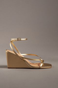 Leather upper, insole Rubber sole Buckle styling Imported | Strappy Wedge Heels by Maeve in Gold, Women's, Size: 39, Leather/Rubber at Anthropologie Modern Gold Wedge Sandals For Spring, Gold Leather Wedge Sandals With 4-inch Heel, Modern Gold Wedge Sandals For Summer, Gold Synthetic Wedge Sandals With Heel Loop, Modern Gold Wedge Sandals With Round Toe, Gold Wedge Sandals With 4-inch Heel, Wedge Outfit, Gold Wedge Heels, Bridesmaids Shoes