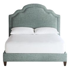 the headboard and foot board of a bed with white sheets on it, against a white background