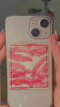 a person holding up an iphone case with a drawing on the back and bottom cover