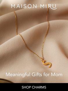 I designed Maison Miru's initial necklace as a personal emblem of strength, a little heirloom that expresses who you are and holds your story. Wear your own initial alone - or add your partner's initial to symbolize your bond. Gift an initial necklace to your mom or your daughter or your BFF - a meaningful gift is one that's always right. Stack on the initials of your children to keep them close to your heart wherever you go. The Maison Miru Secrets & Stories collection is the charm bracelet. Cable Chain Pendant Initial Necklace Gift, Everyday Initial Pendant Charm Necklace For Mother's Day, Modern Gold Initial Necklace Gift, Classic Yellow Gold Initial Necklace For Mother's Day, Mother's Day Yellow Gold Classic Initial Necklace, Mother's Day Classic Yellow Gold Initial Necklace, Minimalist Name Necklace With Cable Chain For Gift, Classic Initial Necklace For Mother's Day Gift, Minimalist Name Necklace With Cable Chain As Gift