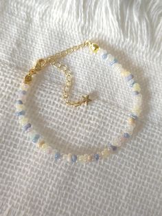 FOR OTHER DAINTY BEADED BRACELETS: https://www.etsy.com/ca/shop/ArtiChouXCanada?ref=seller-platform-mcnav§ion_id=46088511 Bracelet Length: 13-18cm (5.1-7 inches) with a 14k gold filled extender. This bracelet features an array of summer themed pastel colors: blue, white, cream, and light purple Japanese seed beads.  Thread may be visible since it is a handmade product   SIZING  Wrap a soft measuring tape snugly around the widest part of your wrist. Add 1.27cm (0.5in) to that measurement to determine the right bracelet size.  MATERIALS  - Japanese MGB glass seed beads(2x4mm) - 14K gold filled extender  CARE INSTRUCTIONS   To maintain its radiance, gently clean the bracelet with a soft cloth and store it in a jewelry box or pouch when not in use.   SHIPPING INFORMATION  Canada: Standard Ship Adjustable Pastel Beaded Bracelets, Beaded Bracelets Seed Beads, Small Glass Bead Bracelet Ideas, Matching Seed Bead Bracelets, Pastel Beaded Bracelets Gift, Pastel Beaded Bracelets As Gift, Pastel Beaded Bracelets For Gift, Adjustable Pastel Beaded Jewelry, Light Blue Beaded Bracelets As Gift