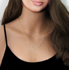 "Gold Beaded Lariat Necklace, Minimal Necklace, Gold or Silver Lariat, Beaded Necklace, Girlfriend Gift, Y Necklace  Gold or Silver Lariat Necklace This Y Necklace is absolutely adorable Makes an everlasting impression with its chic style and eye catching beads.  * High Quality Gold  or Silver Plated over brass Satellite Chain  * Each bead is 3mm spaced every 1\" * Photo #1 is shown at 16\" To View More Lariat Necklaces, Click Here: https://www.etsy.com/shop/SimpleAndLayered?section_id=16420368&ref=shopsection_leftnav_3 All orders are sent packaged in a jewelry box - ready to be gifted! Upon request, we can also include a note card with your own personal message. PLEASE NOTE: In an effort to be greener and to keep shipping costs down, your order will arrive in ONE (1) gift box regardless o Trendy Lariat Jewelry For Gifts, Adjustable Length Choker Chain Necklace, Gold Lariat Clavicle Chain Necklace, Adjustable Double Chain Gold-plated Necklace, Dainty Adjustable Double Strand Chain Necklace, Trendy Lariat Choker With Adjustable Chain, Gold Dangle Chain Necklace For Layering, Gift Double Strand Choker With Adjustable Chain, Double Strand Choker With Adjustable Chain For Gift