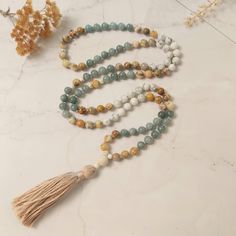 ✨Hello! There's a reason you found us--our handmade Malas, crafted with love and genuine gemstones, are here to bring peace and purpose to your journey. The Mala meant for you will naturally shine through. Trust the Mala you are being guided to.  ◈ Whats included:  Each Mala purchase comes with a card detailing the stone's healing properties, a mantra card, meditation instructions, and a beautiful burlap bag for storage--no gift wrap needed ◈  ◈ What is a Mala?  Malas are traditionally used for Spiritual Hand Knotted Mala As Gift, Adjustable Bohemian Mala For Healing, Bohemian Hand Knotted Mala For Meditation, Bohemian Mala With 8mm Beads For Healing, Adjustable 108 Beads Mala Gift, Bohemian Beaded Mala As Gift, Bohemian Beaded Necklace With 8mm Beads For Gift, Bohemian Hand Knotted Beads As Gift, Bohemian Hand-knotted Beads For Gift