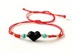 "Red String Azabache Bracelet Beautiful and dainty bracelet with a protection amulet stone (azabache) ideal to keep yourself protected from evil eye, envy and negative vibes or energies. It's made with red cotton cord, turquoise beads and gold filled balls. MATERIALS AND SIZE: Adjustable 5.5\" up to 8.5\" Jet stone/azabache Heart dimension: 1.1cm If you have questions about the product, feel free to reach me out. Don't forget to check out my other items in the store: Https://www.etsy.com/shop/ny Handmade Black Friendship Bracelets For Valentine's Day, Adjustable Black Heart Bracelets, Adjustable Black Heart-shaped Bracelet, Handmade Black Bracelets For Valentine's Day, Handmade Black Bracelet For Valentine's Day, Adjustable Black Heart Bracelet As Gift, Adjustable Black Heart Bracelet For Gifts, Black Bracelet With Heart Charm, Black Heart Beads Bracelet For Gift