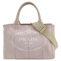 Prada Canape Canvas Tote Small Pink Top Handle Bag with Strap These are professional photos of the actual bag offered by Luxbags. Hemp fabric bag with silk-screened Prada logo and classic enamel triangle logo on the sides. Inside, three pockets and a light hemp fabric lining. CONDITION:VERY GOOD CONDITION This preloved item is in very good condition with medium signs of use. Light scuffs around the corners, handles and edges, stains on the outside and the inside. DETAILS Prada Canape Pink canvas Designer Canvas Bag With Top Handle, Beige Top Handle Bag With Embroidered Logo, Designer Canvas Bag For Daily Use, Chic Tote Bag With Embroidered Logo, Designer Canvas Shoulder Bag, Top Handle Bag With Embroidered Logo, Designer Beige Shoulder Bag With Embroidered Logo, Everyday Top Handle Bag With Embroidered Logo, Designer Bags With Logo For Daily Use