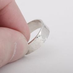 This "Kuro" silver ring is handmade in 925 Sterling Silver in my workshop. The ring is hand crafted using a 92.5% pure silver flat piece, bent to shape, soldered and hammered.Materials: 92.5% pure solid silverBand width: 1/4 inch (6 mm)Ring size: 8 (This is a unique creation. Because of the special finish, it cannot be reproduced or resized. Only one size available. I cannot adjust the ring size) Silver Flats, Silver Jewelry Handmade, Pure Silver, Silver Band, Silver Ring, 4 Inch, Silver Jewelry, Hand Crafted, Handmade Jewelry