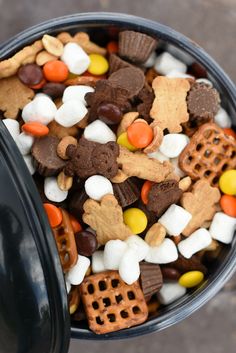 a black trash can filled with halloween treats