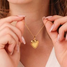 Our dainty gold heart locket with a secure closure is a classic piece that fits every occasion. This locket necklace is made with high-quality materials and expertly crafted to showcase your most cherished memories. ∙DETAILS Chain: 16'' + 2'' Pendant: 20mm x 18mm Made of 925 Sterling Silver Plated with 18K gold Waterproof & hypoallergenic ∙ ∙SHIPPING IMPORTANT: before placing an order, please double check that your address is correct to avoid any delays. Shop more one-of-a-kind pieces: https://w Gold Heart Pendant Locket Necklace, Gold Locket Necklace For Mother's Day Anniversary, Gold Locket Necklace With Heart Charm As Gift, Gold Heart Pendant Locket Necklace For Anniversary, Gold Locket Necklace For Valentine's Anniversary, Gold Heart Locket Necklace For Anniversary Gift, Dainty Heart Locket Necklace For Anniversary, Heart Cut Locket Necklace For Anniversary, Gold Locket Necklace For Anniversary And Mother's Day