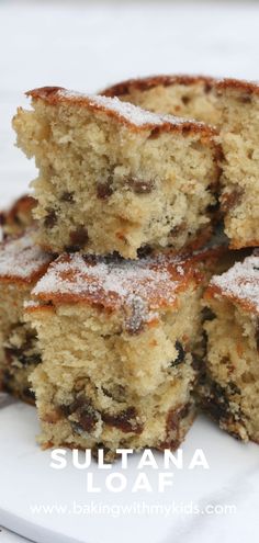 several pieces of cake sitting on top of a white plate with powdered sugar over them