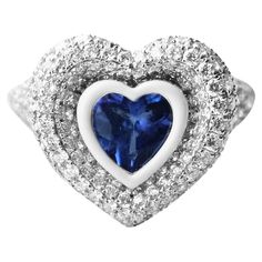 Heart Cut Tanzanite accented with white enamel, outlining the heart shape with pave diamonds. Available in 4.500 grams of 18k White gold. Tanzanite, 1.71 CTS Diamonds 0.80 CTS Tanzanite A true KAMYEN signature style, the heart pinky's have truly become synonymous with the brand. This ring should worn on the pinky or ring finger, as we don't recommend sizes above US 5. Gold Moonstone Ring, Mens Pinky Ring, Tanzanite Diamond Ring, Silver Heart Ring, Tanzanite Stone, Tanzanite Diamond, Unisex Ring, Dress Rings, Fashion Ring