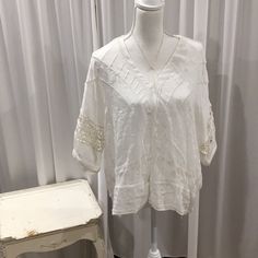 Ivory Must See In Person Elegant White V-neck Lace Top, Off White V-neck Top For Daywear, White V-neck Lace Top, Off White V-neck Blouse For Day Out, White Lace V-neck Top, White V-neck Top With Lace Trim, White V-neck Blouse With Lace Top, White Lace Trim Top For Brunch, Elegant White Lace V-neck Top