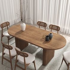 a large wooden table with white chairs around it