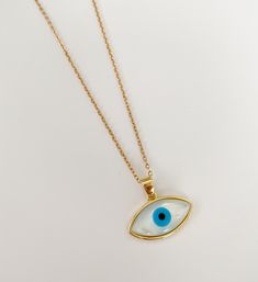 Evil eye necklace/charm Dainty mother of pearl and 18k gold plated eye charm. It will help you to stay away or protected from negative energies, bad vibes, envy, evil eye. Ideal for gifts. It's available only the charm or with the chain. MATERIAL AND SIZE 18k Gold plated Evil eye Mother of pearl 18k Gold filled chain Length: You can choose it If you have questions about the product, feel free to reach me out. Don't forget to check out my other items in the store: Https://www.etsy.com/shop/nyahwi Everyday Yellow Gold Evil Eye Charm Necklaces, Gold Evil Eye Amulet Jewelry, Gold Plated Evil Eye Amulet Necklace, Gold-plated Evil Eye Amulet Necklace, Gold Plated Evil Eye Round Pendant Jewelry, White Evil Eye Jewelry Gift, Amulet Eye Necklace Gift, 14k Gold Filled Evil Eye Jewelry, Eye-shaped Amulet Necklace As Gift