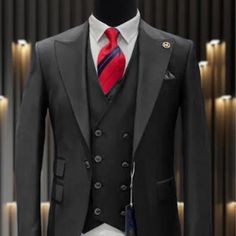 This Modern Fit Suit Features A Wide Peak Lapel, 1 Button Closures, Double Breasted Vest, Side Vents, And Matching Flat Front Pants. Black Double-breasted Tuxedo For Office, Black Double-breasted Tuxedo For Business, Black Double-breasted Suit With Double Button Closure, Classic Black Double-breasted Tuxedo, Black Single-breasted Suit For Semi-formal Occasions, Black Slim Fit Office Sets, Classic Black Tuxedo With Double Button Closure, Business Tuxedo Suit With Button Closure, Black Double-breasted Suit With Hidden Button Closure