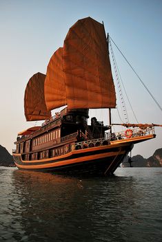 a large boat floating on top of a body of water