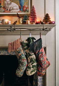 christmas stockings hanging from a fireplace mantel