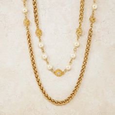 For Sale on 1stDibs - - Vintage item - Measures 94' long - Gold plated - Crystal accents - Faux pearls - By Chanel (signed on hangtag) - Made in France - Circa 1980s - Estate Luxury Gold-tone Pearl Chain Necklace, Luxury Pearl Chain Necklace For Wedding, Formal Gold Double Strand Pearl Necklace, Gold Double Strand Pearl Necklace For Formal Occasions, Luxury Pearl Necklace With Metal Chain, Luxury Pearl Chain Metal Necklace, Luxury Metal Pearl Chain Necklace, Luxury Gold Double Strand Pearl Necklace, Luxury Metal Chain Necklace With Pearl Chain