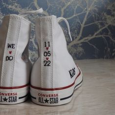 two white converse shoes with the words converse all star written on them, side by side