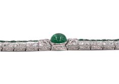 For Sale on 1stDibs - Art Deco Emerald and Diamond Bracelet. This bracelet has cabochon and square- cut emeralds, old and single-cut diamonds all set in platinum, Length 6.875 Luxury Silver Tennis Bracelet With Emeralds, Formal Silver Tennis Bracelet With Emeralds, Formal Silver Emerald Tennis Bracelet, Silver Emerald Tennis Bracelet For Formal Occasions, Formal Silver Diamond Bracelet With Emeralds, Formal White Gold Emerald Tennis Bracelet, Formal White Gold Diamond Bracelet With Emerald, Emerald Diamond Bracelet In White Gold For Formal Events, White Gold Emerald Bracelet