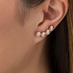 Creative and clever, these lunar crawler earrings make any day magical. Crafted in sterling silver with 14K rose gold plate, each whimsical earring features a curved quartet of sculpted circles - each adorned with four petite lab-created shimmering white sapphires in crescent moon-shaped frames. Buffed to a brilliant luster, these earrings secure with long wire backs that stabilize the climbing design. Delicate Rose Gold Ear Climbers As Gift, Delicate Rose Gold Ear Climbers For Gift, Rose Gold Cartilage Drop Earrings, Rose Gold Ear Climbers With Ear Wire As Gift, Rose Gold Ear Climbers As Gift, Rose Gold Sterling Silver Single Ear Cuff, Rose Gold Round Cartilage Earrings With Matching Pair, Rose Gold Round Cartilage Earrings, Elegant Rose Gold Sterling Silver Cartilage Earrings