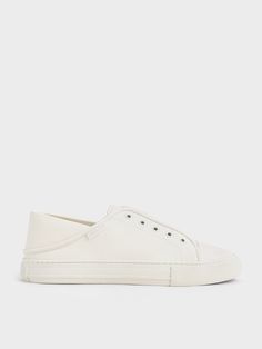 White sneakers will never go out of style. This pair of slip-on sneakers is a refreshing take on the iconic shoe style. Featuring a convenient no-lace elastic closure, they are a breeze to put on and take off. Versatile enough to be dressed up and down with ease, they will look just as good with your favourite jeans as with a flowy maxi dress. White Slip On Sneakers, Flowy Maxi Dress, White Slip, Charles Keith, Shoe Style, Slip On Sneakers, White Sneakers, Go Out, Out Of Style