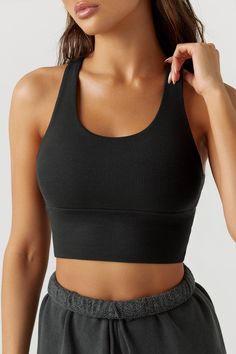 Scoop neck, longline tank bra with a racerback silhouette. Double lined. Our FlexRib fabric was designed with function and comfort in mind. It's soft, stretchy and made to move with you. You'll want to wear it all day, every day. Color: Black FlexRib Sizing: X/S (0-2), S/M (4-6), M/L (8-10) Model is 5'8" and wearing size X/S Fabric: 90% Rayon, 10% Spandex Care: Machine Wash Cold With Like Colors.Care: Lay Flat to Dry. Made in Los Angeles Everyday Solid Scoop Neck Sports Bra, High Stretch Activewear With Built-in Bra And Scoop Neck, Everyday Scoop Neck Sports Bra, Black Sports Bra With Seamless Construction And Wide Straps, High Stretch Scoop Neck Sports Bra With Built-in Bra, Scoop Neck Sports Bra With Built-in Bra For Pilates, Seamless T-back Tank Top For Workout, Functional Black Tank Top With Seamless Construction, Solid Color Sports Bra With Built-in Bra, Racerback