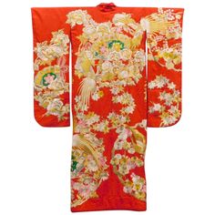 A visually striking antique Uchikake Wedding Kimono/Robe for ceremonial occasion, circa end of Meiji to Taisho period 1910s-1930s. This bridal outer garment is of a bright red color that features elaborate and intricate embroidery. Using brilliant colored and gold threads, the artisan decorated the kimono with the most auspicious symbols including flying phoenix, blooming peonies, fans, maple branches, and wisteria flowers. They form roundel motifs in a highly elaborate layout, especially striki Vintage Red Kimono For Tea Ceremony, Vintage Silk Kimono For Wedding, Ceremonial Vintage Kimono, Vintage Red Kimono For Wedding, Vintage Long Kimono For Wedding, Traditional Embroidered Kimono For Tea Ceremony, Traditional Ceremonial Kimono For Festivals, Vintage Wedding Kimono With Kimono Sleeves, Traditional Red Kimono For Wedding