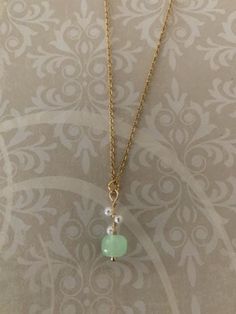 "Lovely, sweet and dainty gold tone, hetian jade bead and simulated seed pearls necklace, hetian jade necklace, mint green necklace, mint necklace, hetian jade pendant, green and pearl, green Pendant measures 7/8\" L X 5/16\" W and is on an 18\" chain." Mint Green Necklace, Mint Necklace, Simple Jewellery, Green Pendant, Green Pendants, Metal Clay Jewelry, Hetian Jade, Pearls Necklace, Jade Necklace