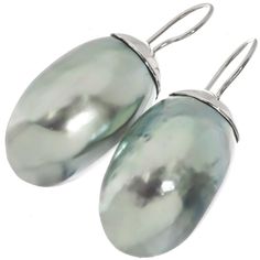 925 Sterling Silver Iridescent Osmena Pearl Nautilus Shell Sterling Earrings, 1 1/4"    Hook Style:  French wires Earring Material:  925 sterling silver Earring Size:  31x17mm(1 1/4x3/4") excl wires. Earring Weight:  ~3 grams/ea Earring Material:  Nautilus shell Formal High Luster Sterling Silver Earrings, Iridescent Sterling Silver Pierced Earrings, Iridescent Sterling Silver Earrings, Iridescent Sterling Silver Earrings For Pierced Ears, Elegant Iridescent Nickel-free Earrings, Elegant Iridescent Pierced Earrings, Formal Silver High Luster Pearl Earrings, Silver Oval Pearl Earrings, Silver Oval Pearl Earrings For Pierced Ears